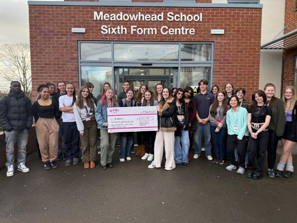 sixth form committee presents cheque to st.lukes