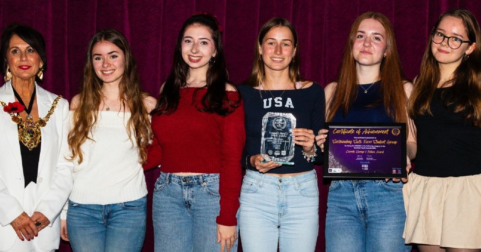 sixth form students with their award for their sustainabag project