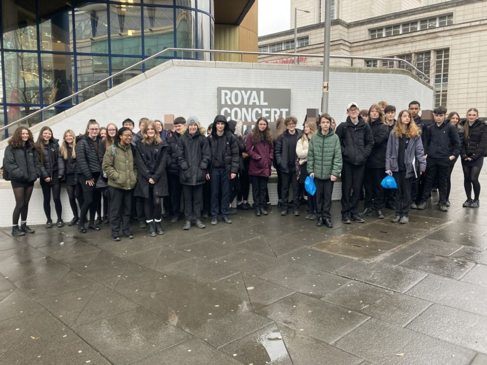 Students pose for photo outside the Poetry Live venue