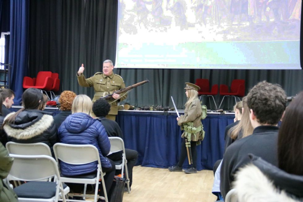 students listen attentively to presenter dressed as a WW1 soldier