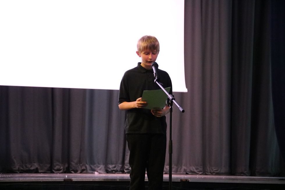 student reads at the evening event