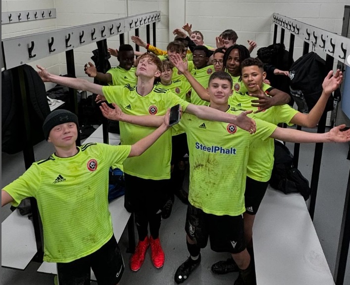 y9 team photo in the dressing room