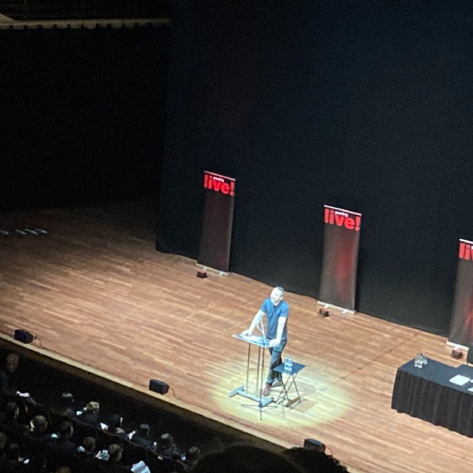 Poet on stage at the Poetry live event